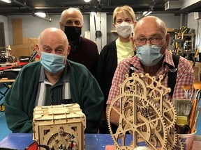 Claude Coderre and Gerry Desjardins, in the foreground, has applied their woodworking skills over the years to develop a number of exhibits on display at Science Timmins. On Satuirday, the workshop at Science timmins was renamed the Coderre-Desjardins Woodworking Shop. In the background are Science Timmins founders Antoine Garwah and Lorraine Cantin.

Supplied