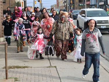 Members of No More, who are dedicated to raising awareness about the deadly risks of using opioids, wanted to host a fun event for a change and organized a zombie walk through the streets of Timmins on Saturday. Louise Lefebvre, a founding member of No More, is seen leading the group on the right.

ANDREW AUTIO/The Daily Press
