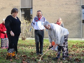 Northern College president Audrey Penner breaks ground as the manager of Indigenous services and initiatives Trudy Wilson and Elder Morris Naveau look on.

Dariya Baiguzhiyeva/Local Journalism Initiative