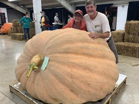 Doris and Ron Wray won the prize for the largest pumpkin at the Norfolk County Fair on Sunday. The Green's Corners couple won top prize and $2,000 with a pumpkin weighing 1,746 pounds. Vincent Ball/Postmedia Network