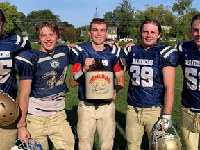 The Delhi Raiders defeated the Simcoe Sabres last week 19-0 at Simcoe Composite School in the teams' annual Mud Jug game. Among those savouring the win were, from left, Raiders Dylan VanSchalkwyk, Tre Hodder, Adam Leatherland, Nathan Dobbie, and Riley Brackenbury.  Monte Sonnenberg