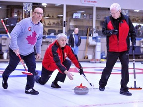 A file photograph at the Simcoe Curling Club, from 2019, shows Simcoe curler Peter Wheatley, flanked at left by teammate Denis Grasis of Port Dover and teammate Jim Simmons of Simcoe at right. Monte Sonnenberg/Postmedia