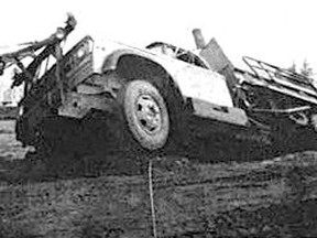 TRUCK IN THE MUCK – A three-ton patrol dump truck belonging to the Department of Transportation and Communication quietly slithered into a small quagmire and began sinking in the quicksand 50 years ago. It was on the grounds of the DTC yards where they are excavating an area that is to be paved. Cranes were required to get it back on solid ground.