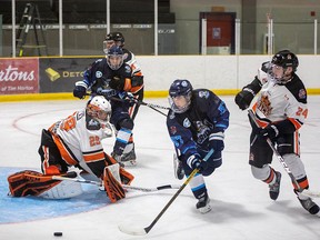 Cochrane's Benjamin Orgil tries to get one past Hearst's netminder Liam Oxner but failed to land it. Photo by Emily Martin