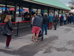 Patrons line up for Horton FarmersÕ MarketÕs 2021 opening day in May. Unwavering community support is credited with the marketÕs rebound this year after a near-crippling from COVID-19 in 2020.

Eric Bunnell