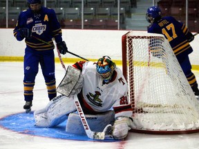 Thistles netminder Kaden King corrals a puck during Manitoba under-18 AAA Hockey League action at the Kenora Recreation Centre.