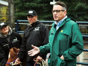 Kenora-Rainy River MPP Greg Rickford (right) speaks at a funding announcement alongside Kenora Bed N' Bale operators Laura and Dave Loohuizen on Thursday, Oct. 14. s