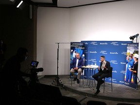 Ontario Energy Minister Todd Smith (left) takes part in a webcast Thursday afternoon with Bruce Power executive James Scongack to announce Bruce Power's new increased power output and isotope harvest milestones. Greg Cowan/The Sun Times