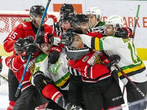 The London Knights and Owen Sound Attack players rough it up during the first period of their game at Budweiser Gardens in London, Ont. on Saturday October 23, 2021. Derek Ruttan/The London Free Press/Postmedia Network