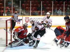 Xavier Medina sticks his leg out to stop a backdoor backhand opportunity by Thomas Chafe in the first period as the Owen Sound Attack host the Windsor Spitfires inside the Harry Lumley Bayshore Community Centre Saturday, October 23, 2021. Greg Cowan/The Sun Times