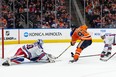 Edmonton Oilers’ Connor McDavid scores a late game goal on New York Rangers’ goaltender Alexandar Georgiev on Friday night.