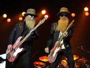 Dusty Hill, left, and Billy Gibbons of ZZ Top perform on stage during a concert. ZZ Top is playing Budweiser Gardens on April 22 with a new bassist to replace Hill, who died in July. File photo