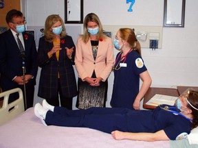 Georgian College president and CEO MaryLynn West-Moynes speaks with first-year practical nursing students Maddie Mouillierat (standing) and Olivia Given as Bruce-Grey-Owen Sound MPP Bill Walker, left, and Ontario Colleges and Universities Minister Jill Dunlop (middle) look on. Dunlop was at Georgian's Owen Sound campus to confirm the province has given it the green light to offer a four-year standalone nursing degree program in September 2022. DENIS LANGLOIS