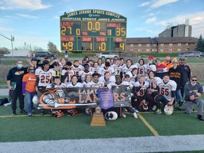 Members of the Lasalle Lancers junior boys football team celebrate their SDSSAA championship.