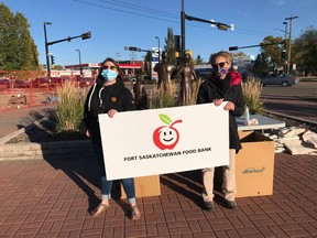 The Fort Saskatchewan Food Bank staff and volunteers, pictured at the Farmer's Market in downtown Fort Saskatchewan this fall, are accepting applications for Christmas Hampers this month. Photo via Facebook.