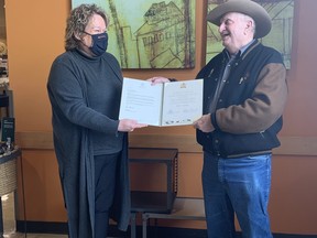 Fort Saskatchewan-Vegreville MLA Jackie Armstrong-Homeniuk presented local farmer Orvis Schneider with an award to recognize the Scnhneider family's legacy of 125 years of farming in Alberta on Friday, Oct. 29, 2021. Photo by Jennifer Hamilton / The Record