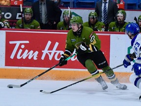 Russian import Matvey Petrov of the North Bay Battalion skates against Liam Ross of the Sudbury Wolves in Ontario Hockey League action Sunday. The visiting Troops suffered a 3-1 setback against their northern rivals.