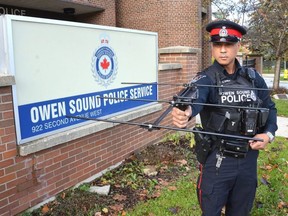 Owen Sound Police Service Const. Carlo Obillos with the radio-frequency-based tracking system used in Project Lifesaver. The program helps find people who wander through the use of the system that uses a wristband that emits a continuous radio frequency.