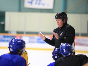 Sudbury Nickel Capitals head coach Brian Dickinson speaks to players in this file photo.