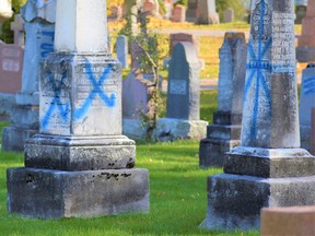An estimated 200 gravestones were defiled with all manner of spray paint at the St. James Roman Catholic Cemetery adjacent the Belleville Cemetery as photographed Thursday.
Vandals also defaced 225 gravestones at Elmwood Cemetery on River Road in Thurlow Ward. Investigation by Belleville Police continues. DEREK BALDWIN