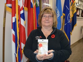 Edna Hutchings, Poppy Campaign chair at the Royal Canadian Legion in Spruce Grove, holds a commemorative Poppy that the Royal Canadian Legion produced to celebrate the Remembrance Poppy's 100th anniversary in Canada. Commemorative Poppies are available online at www.legion.ca or at Legion branches across the country. Kristine Jean
