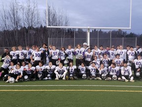 Lo-Ellen Park Knights players and staff pose for a team photo after winning the SDSSAA senior boys football championship at James Jeroms Sports Complex in Sudbury, Ontario on Thursday, November 4, 2021.