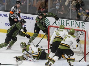 Kingston Frontenacs Paul Ludwinski, left, with Lucas Edmonds, gets a shot on North Bay Battalion goaltender Joe Vrbetic just prior to Edmonds scoring as Tnias Mathurin (5) and Avery Winslow look on in Ontario Hockey League action at the Leon's Centre in Kingston on Friday.