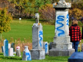 A $5,000 reward is being offered as Belleville Police Service steps up criminal investigation into the desecration of 425 grave markers at two Belleville cemeteries in recent days. DEREK BALDWIN