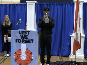 Bev Facey Community High honoured the fallen and serving military members during a virtual ceremony on Nov. 5. In addition, the school also created an Entrance of Remembrance, where staff and students showcased historic military memorabilia among a wall of poppies. Photo courtesy Bev Facey