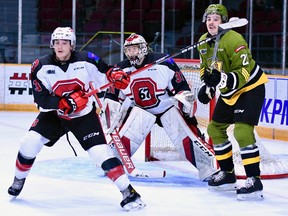 Kyle Jackson of the North Bay Battalion looks for the puck for a scoring chance while Ottawa 67's defenders Teddy Sawyer and goaltender Will Cranley have other ideas in Ontario Hockey League play Sunday at TD Place. The Troops completed a three-game eastern swing.
Sean Ryan Photo