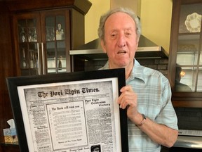 Southampton's Bill Streeter holds an enlarged front page of the November 13, 1918 Port Elgin Times that offers an enlightening glimpse in to how this community celebrated the Armistice. [Frances Learment]