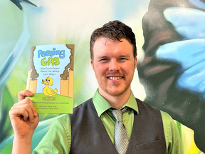 Author Phillip Craig, Director of the NII Explore program at the Nuclear Innovation Institute in Port Elgin, holds his new book Passing Gas: How Clean Energy Makes the World Less Smelly.