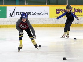 Jaxon McMahon, left, and Andy Moxam practice with the Sudbury Sprinters speed skating club in 2020.