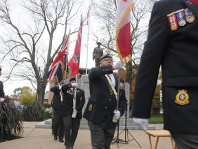 A colour guard marches from the cenotaph in Sarnia's Veterans Park following a rededication ceremony on Oct. 30. Paul Morden/Postmedia