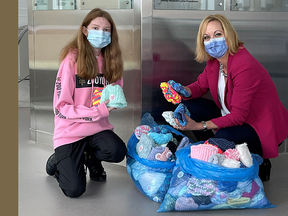 15-year-old Paige Buchanan donated 200 loom hats for newborns born at the North Bay Regional Health Centre. This is her second donation. Tammy Morison, president and CEO of the North Bay Regional Health Centre Foundation, accepts the hats which will be delivered to the labour and delivery unit. Submitted