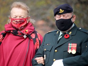 Remembrance Day service at cenotaph on Queen Street East on Thursday, Nov. 11, 2021 in Sault Ste. Marie, Ont.  Silver Cross mother Donna Crosson prepares to lay a wreath. (BRIAN KELLY/THE SAULT STAR/POSTMEDIA NETWORK)