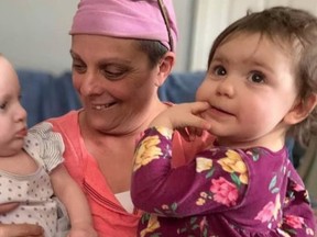 Mary-Ann Vigna Brown cuddles with her granddaughters. The single mom to three girls and grandmother to two is struggling to make ends meet as she undergoes treatment for cancer. (GoFundMe photo)