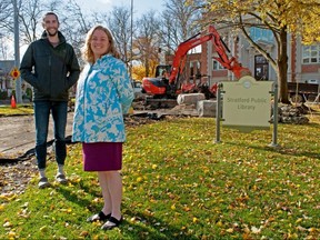 Jr. landscape designer Craig Klomp (left), and Stratford Public Library CEO Julia Merritt in front of the library’s garden as Kalvin Sawyer and Kevin Klomp of Klomp’s Landscaping begin a project to refurbish the garden in front of Stratford Public Library. (Chris Montanini/Stratford Beacon Herald)
