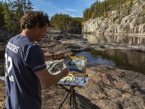 James Aiken at "one of the nicest places I've been in my life," sketching at the top of the first falls at the Golden staircase, in the Boreal forest. Gary McGuffin