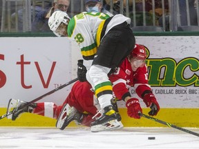 Bryce Montgomery of the London Knights pins Marc Boudreau of the Soo Greyhounds against the end boards in the first period of their game  at Budweiser Gardens on Friday night. The Knights scored four second-period goals in a 7-4 win over the Greyhounds. The Hounds are in Windsor Saturday night for a matchup with the Spitfires.