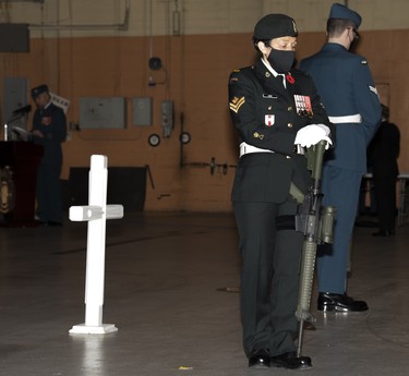 Soldiers stand on guard during the Remebrance Day ceremony held at 1 Air Maintenance Squadron on November 11, 2021 at 4 Wing Cold Lake.