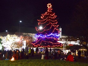 Members of the local First Nation community gather Sunday evening along with Greater Sudbury Police for a tree-lighting ceremony outside the downtown police station. The lights honour the many children who died at residential schools, along with missing and murdered Indigenous women, girls and two-spirited people.