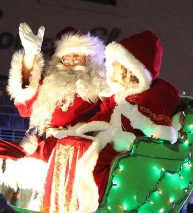 Santa Claus waves to youngsters in the crowd during the 2021 Santa Claus Parade held in Downtown Timmins Saturday night.

RON GRECH/The Daily Press