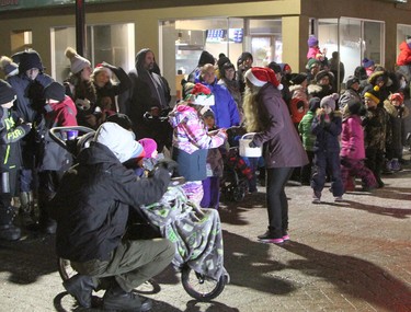 It was like Halloween again as parade volunteers handed out candy canes and other treats to youngsters along the path of the Timmins Santa Claus Parade Saturday night.

RON GRECH/The Daily Press