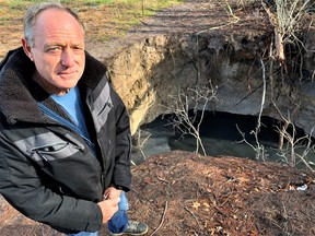 Over the past 15 months, the toxic spring at the rear of Tom Edwards’ property on Silver Hill Side Road has turned into a sinkhole 25 feet by 40 feet and growing. The Ministry of Natural Resources has ordered Edwards to fix the problem at his own expense. – Monte Sonnenberg