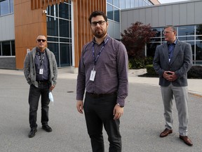 Hastings Prince Edward Public Health's Roberto Almeida, left, Dr. Ethan Toumishey and Eric Serwotka stand outside the health unit Oct. 15.