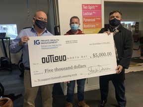 Mark and Steven Deacon presented Seth Compton, executive director of OUTLoud, with a $5,000 cheque Wednesday to help pay for ongoing expenses.

Jennifer Hamilton-McCharles, The Nugget