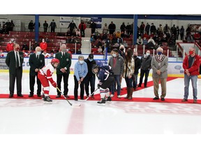 The 36th Pembroke Regional Silver Stick Tournament was officially opened Nov. 12 with a ceremonial puck drop ahead of the Pembroke Kings game. Taking part in the faceoff (from left) were International Silver Stick (ISS) commissioner Ross McConnell, ISS director Charles Chappell, PRSS tournament director Norbert Chaput, Diane Martin and her children Kim, Andy and Kelly, Pembroke Mayor Mike LeMay and Pembroe Minor Hockey vice-president Glenn Casey. Taking the faceoff are Pembroke’s Sawyer Spital and a member South Grenville. In the back are sponsors Sherry Mulvihill, David Minns, Greg Lebarron and Evan Lavallee. Missing were Tyler Godin and Ray and Barb Pilon.