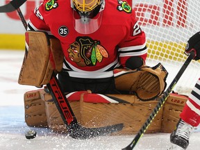 Chicago Blackhawks netminder Marc-Andre Fleury makes a save against the Pittsburgh Penguins at the United Center on Nov. 9. Fleury can be seen wearing Red Lake artist Patrick Hunter's mask.