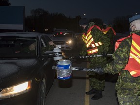 Members of 22 Wing/CFB North Bay collect food and monetary donations for the My Team Cares program in support of the North Bay Food Bank Dec. 8, 2020.
Master Corporal Alana Morin, 22 Wing Imagery Section, North Bay